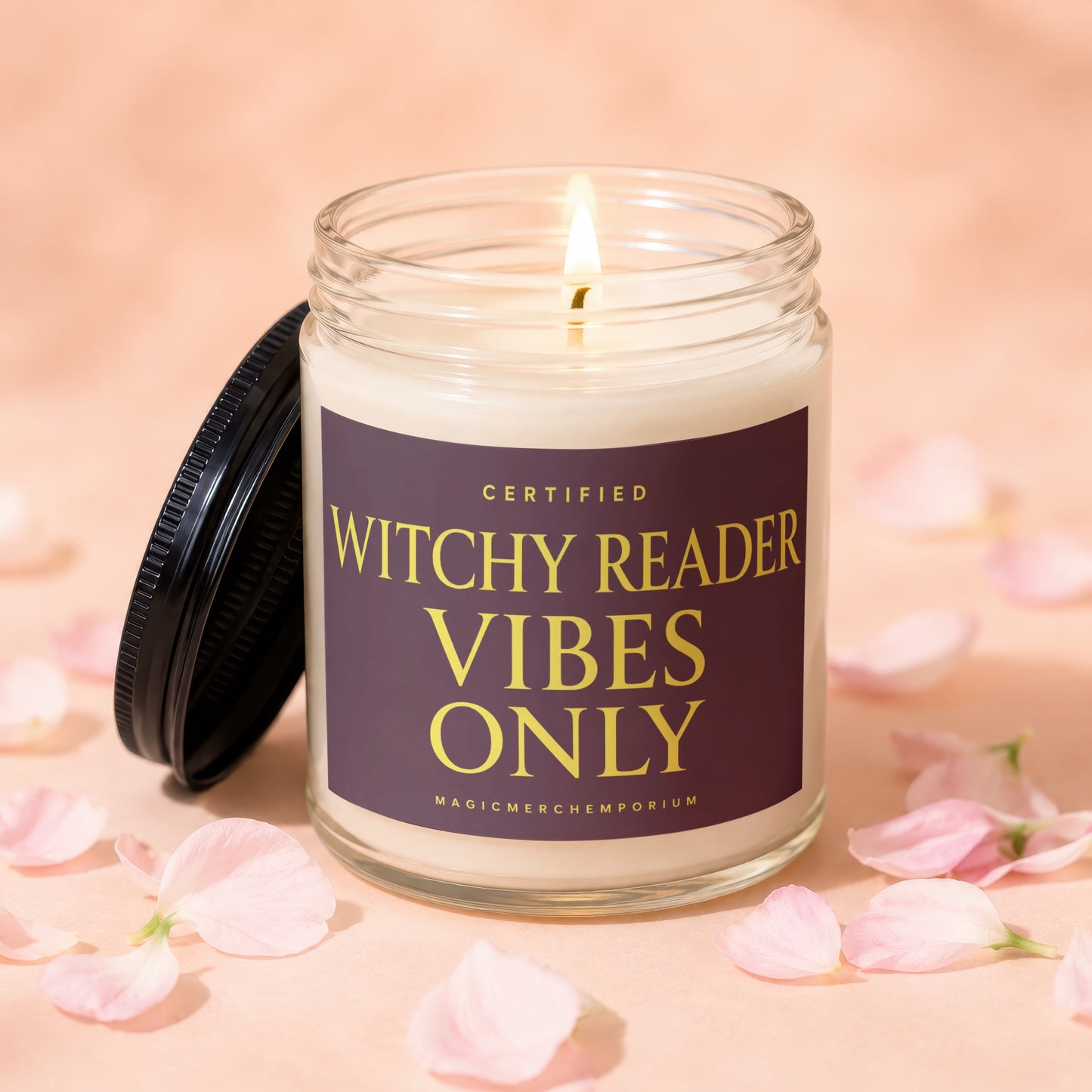 Glass candle with lit wick and lid beside it, reading "Certified Witchy Reader Vibes Only".