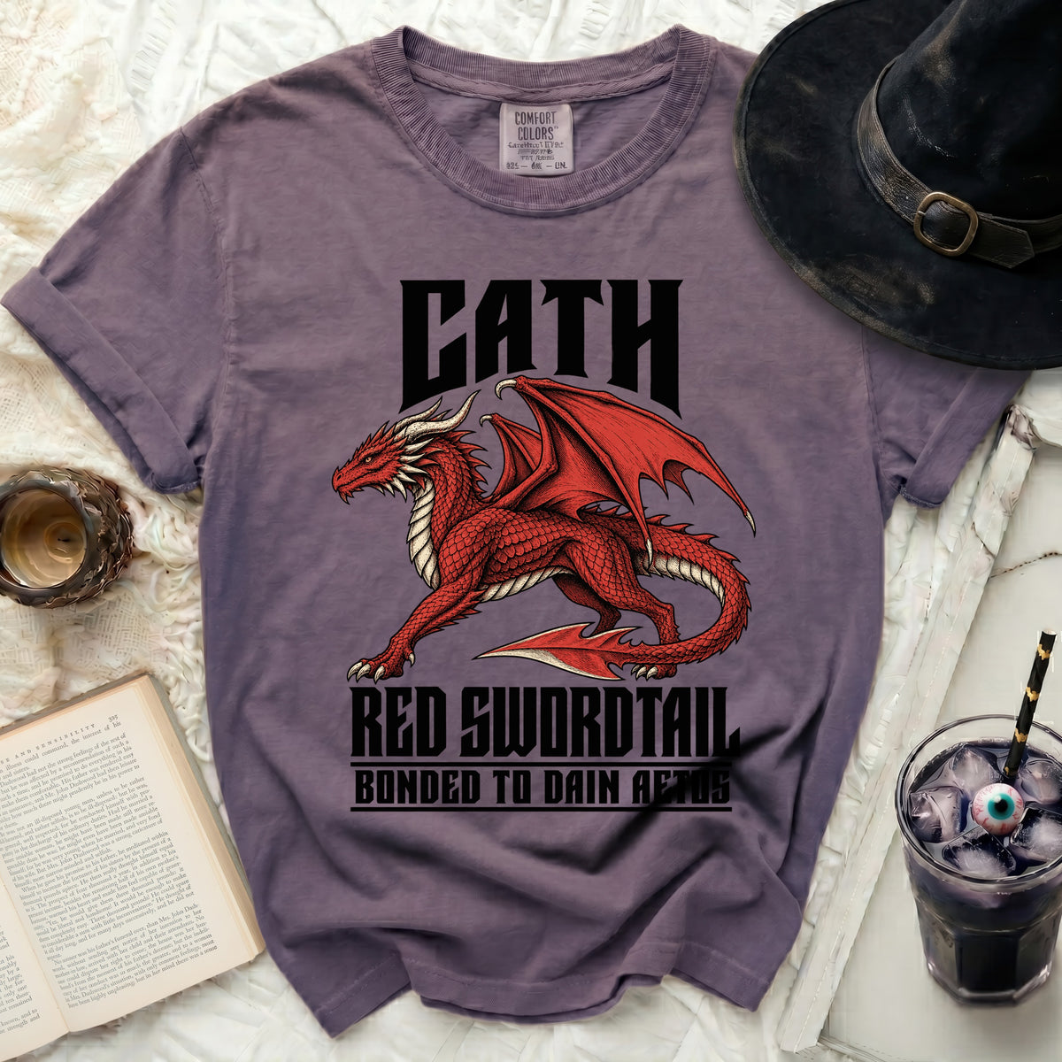 Purple t-shirt with a red dragon graphic and text "CATH RED SWORDTAIL".