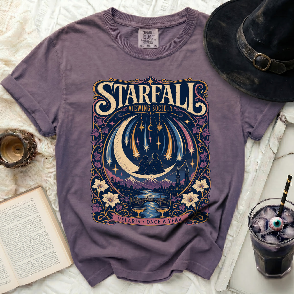 Purple t-shirt with "Starfall Viewing Society" and celestial art.
