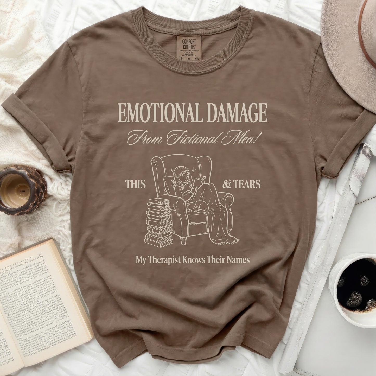 Brown t-shirt with "Emotional Damage From Fictional Men!" and "My Therapist Knows Their Names" text.