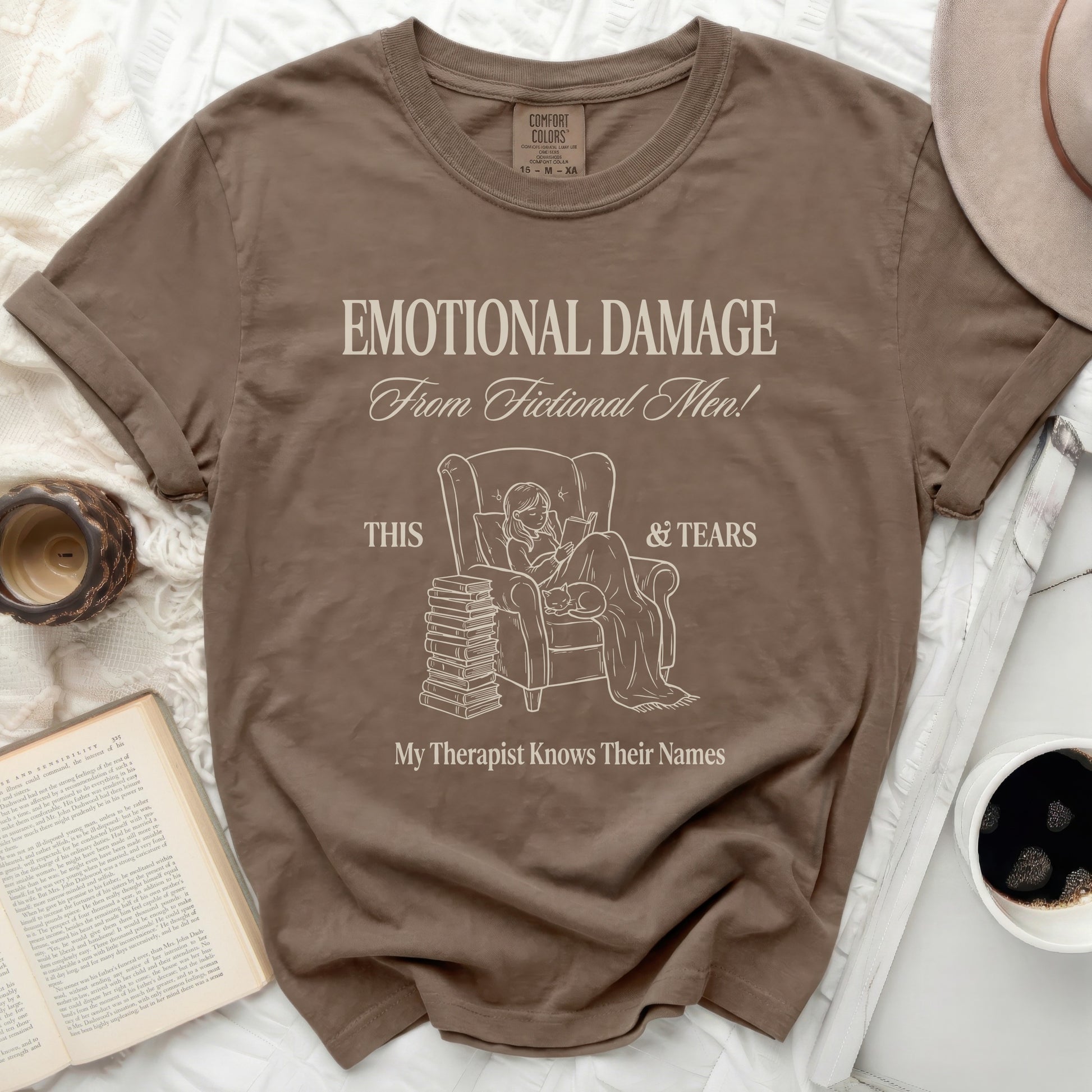 Brown t-shirt with "Emotional Damage From Fictional Men!" and "My Therapist Knows Their Names" text.