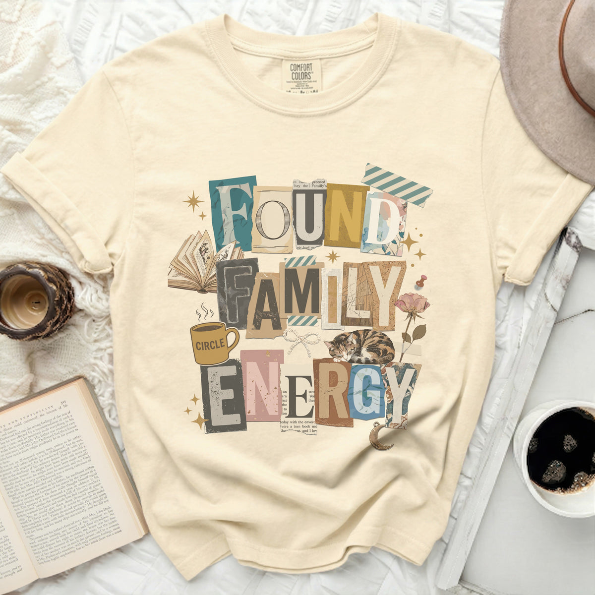 Cream t-shirt with "FOUND FAMILY ENERGY" collage design.