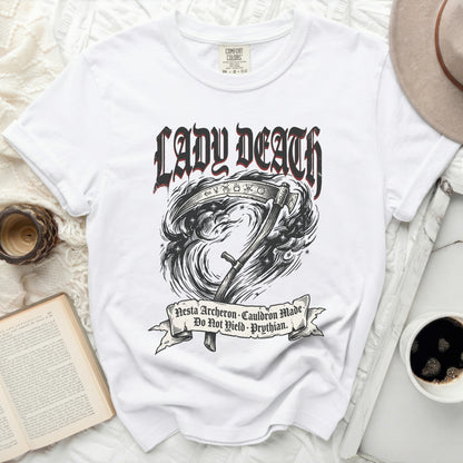 White t-shirt with "Lady Death" text, grim reaper scythe, and banner with Latin text.