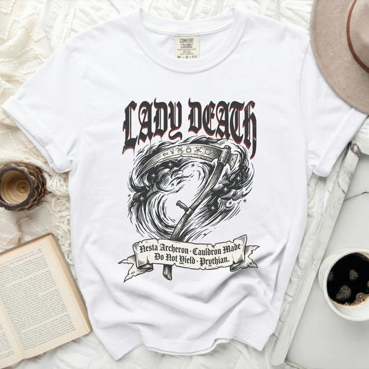 White t-shirt with "Lady Death" text, grim reaper scythe, and banner with Latin text.