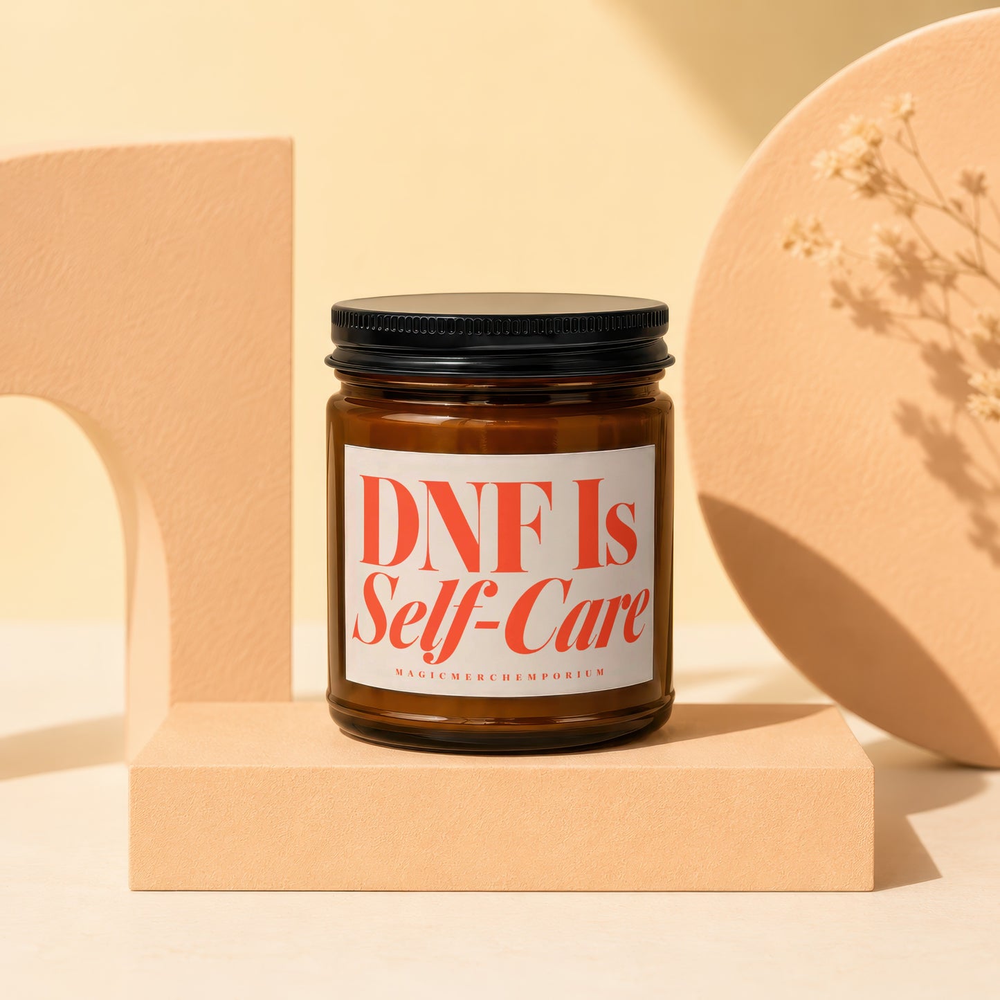 Amber glass candle with label reading "DNF Is Self-Care."