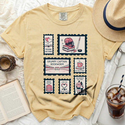 T-shirt with postage stamp graphics featuring hockey and romantic themes.