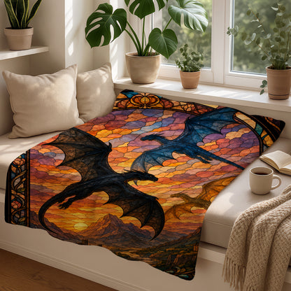 Stained glass tapestry featuring dragons over a mountain landscape at sunset.