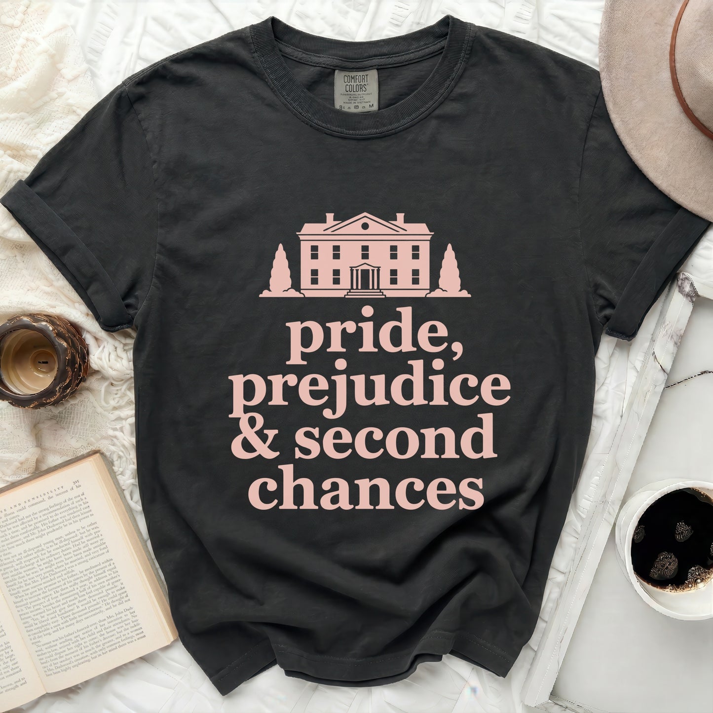 Black Comfort Colors t-shirt with pink text and a house graphic.