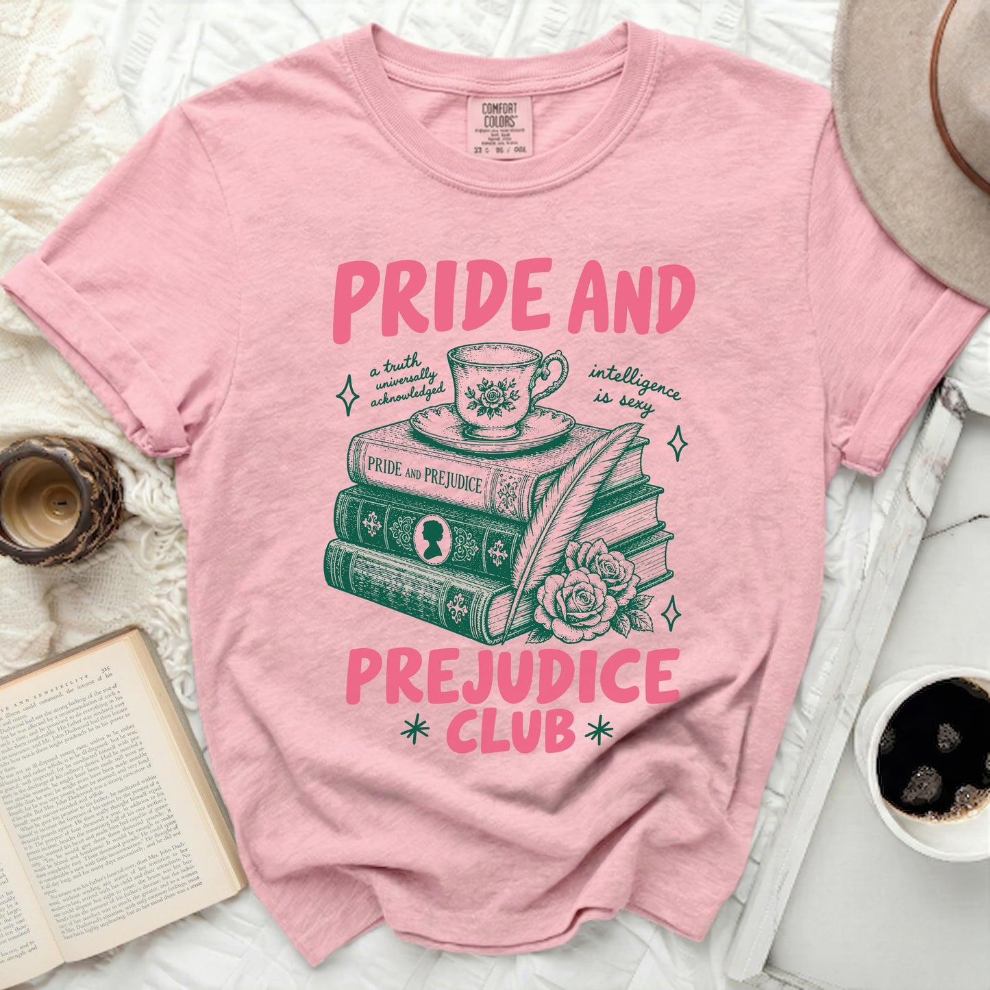 Pink t-shirt with "Pride and Prejudice Club" text and book illustration.
