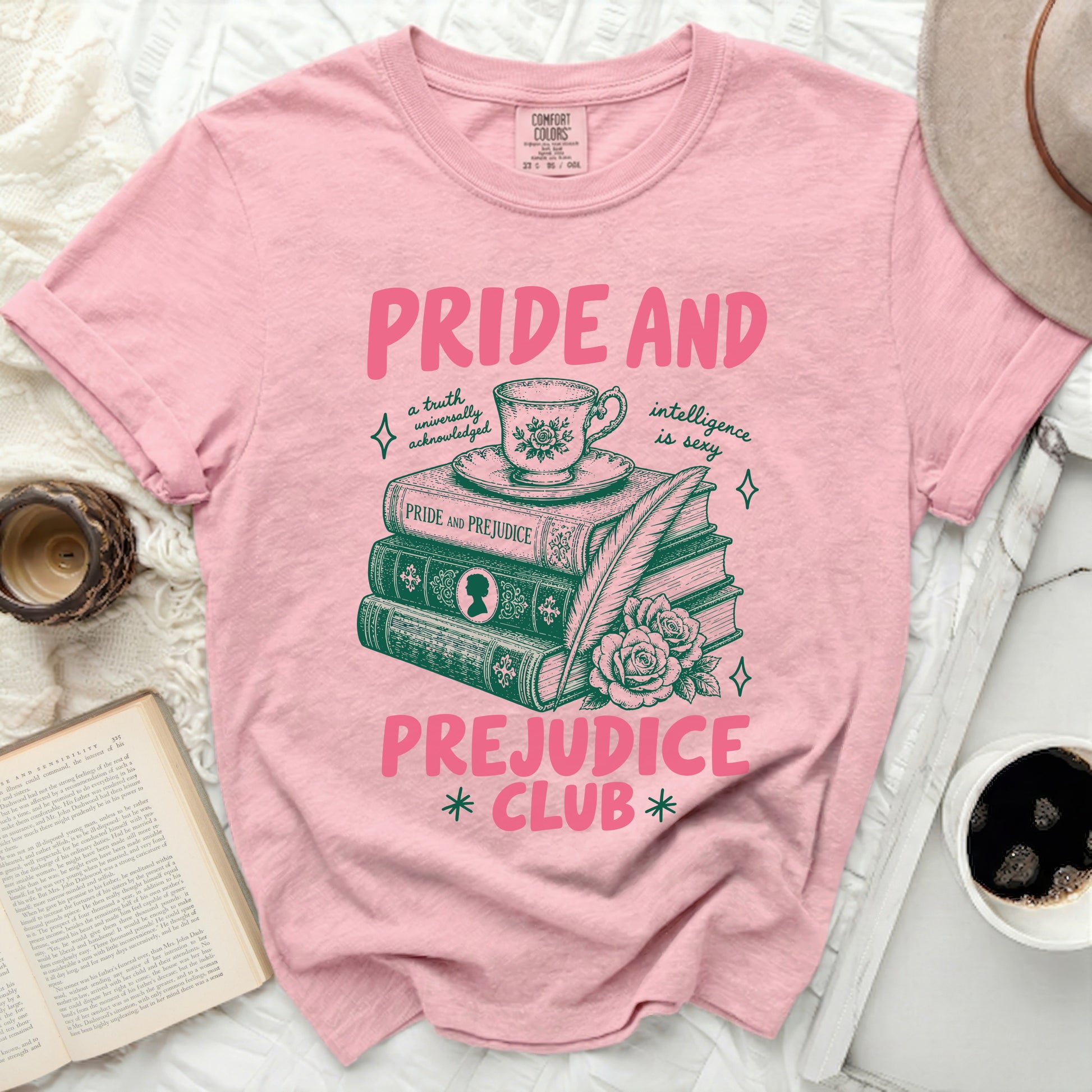Pink t-shirt with "Pride and Prejudice Club" text and book illustration.