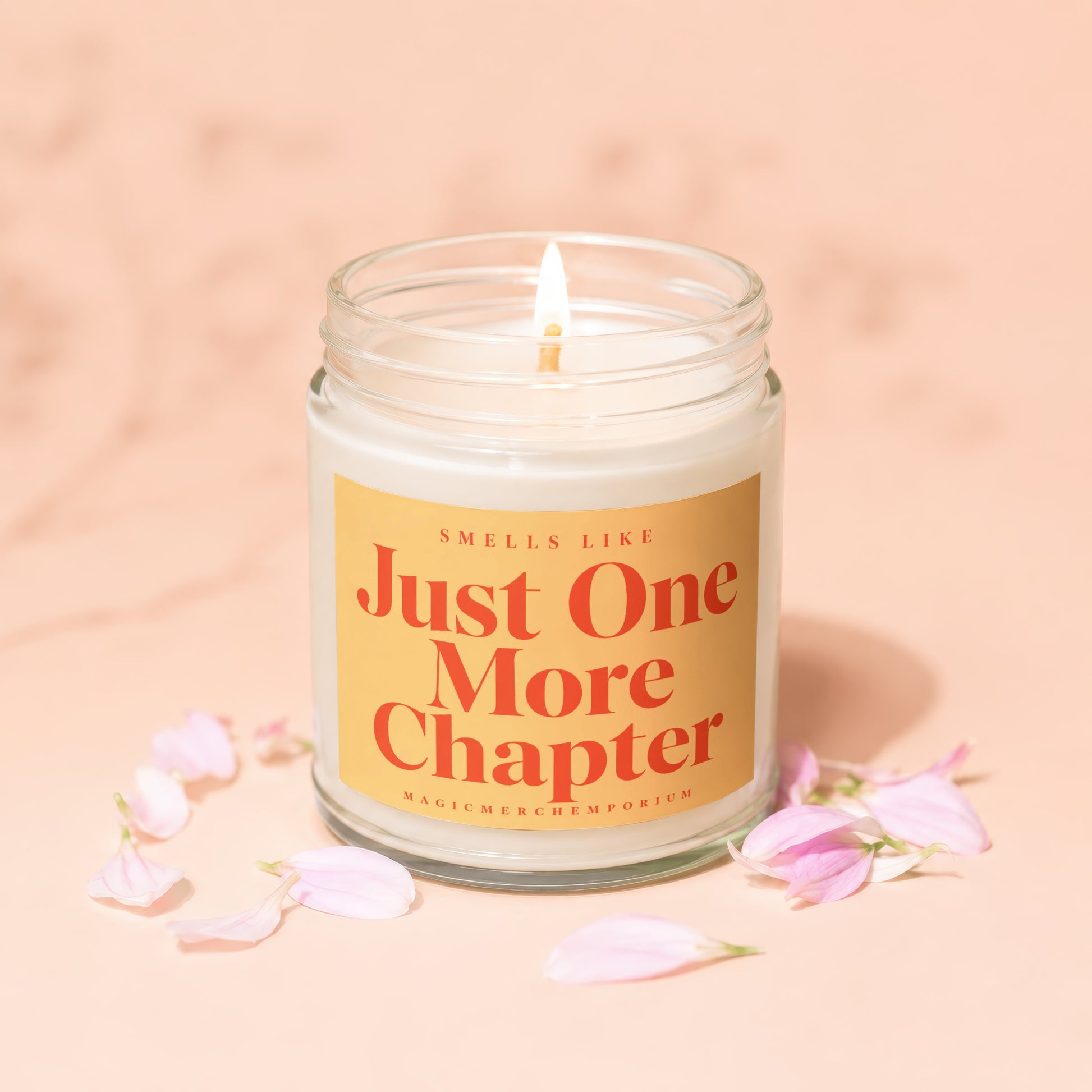 Scented candle in a jar with text "Smells Like Just One More Chapter".