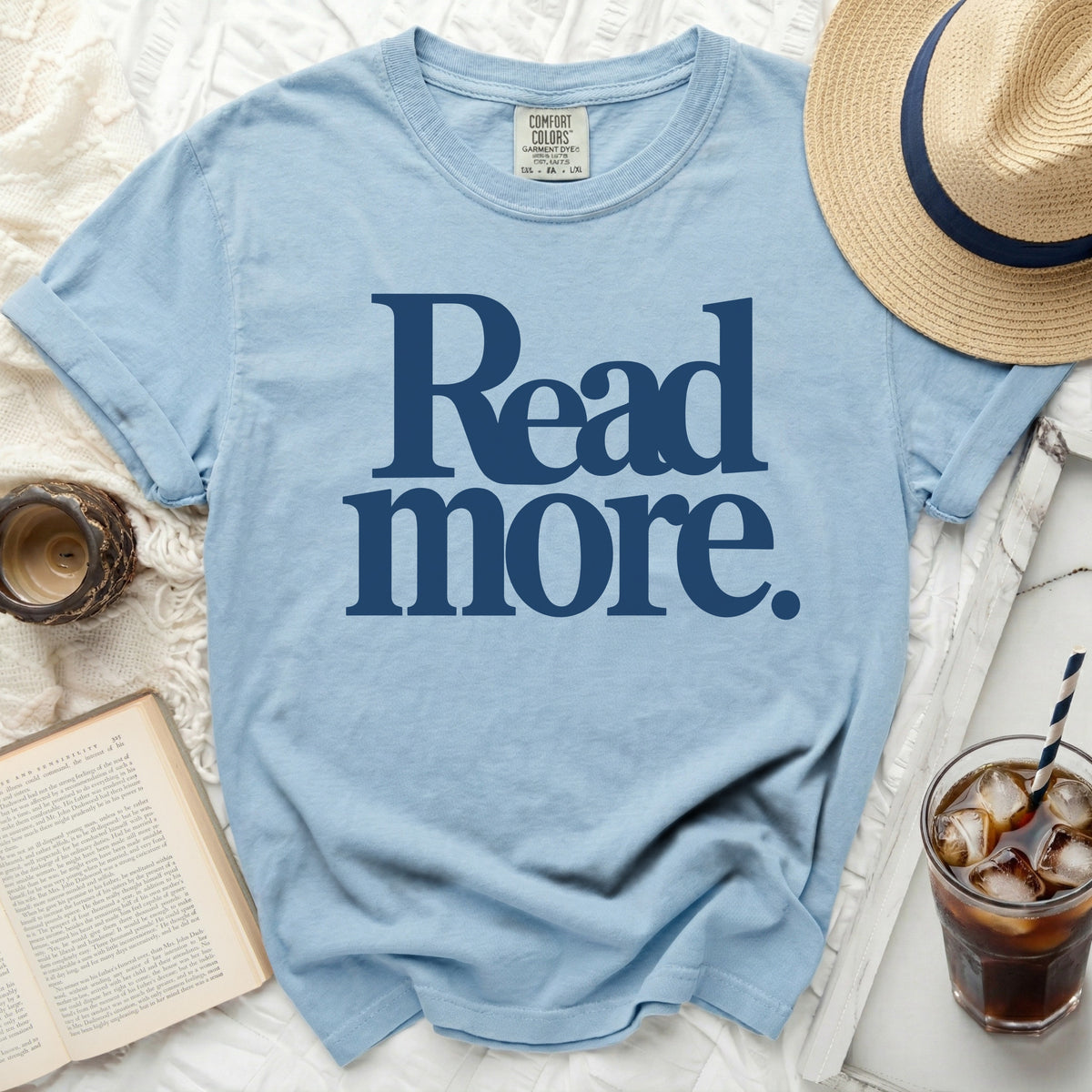Light blue t-shirt with "Read more." printed in navy blue.