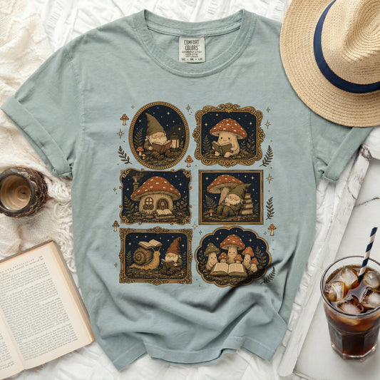 T-shirt with comfort colors tag and a graphic of gnomes, mushrooms, and a snail reading books.