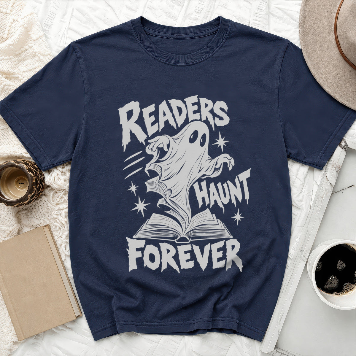 Navy t-shirt with a ghost rising from an open book, reading "Readers Haunt Forever".