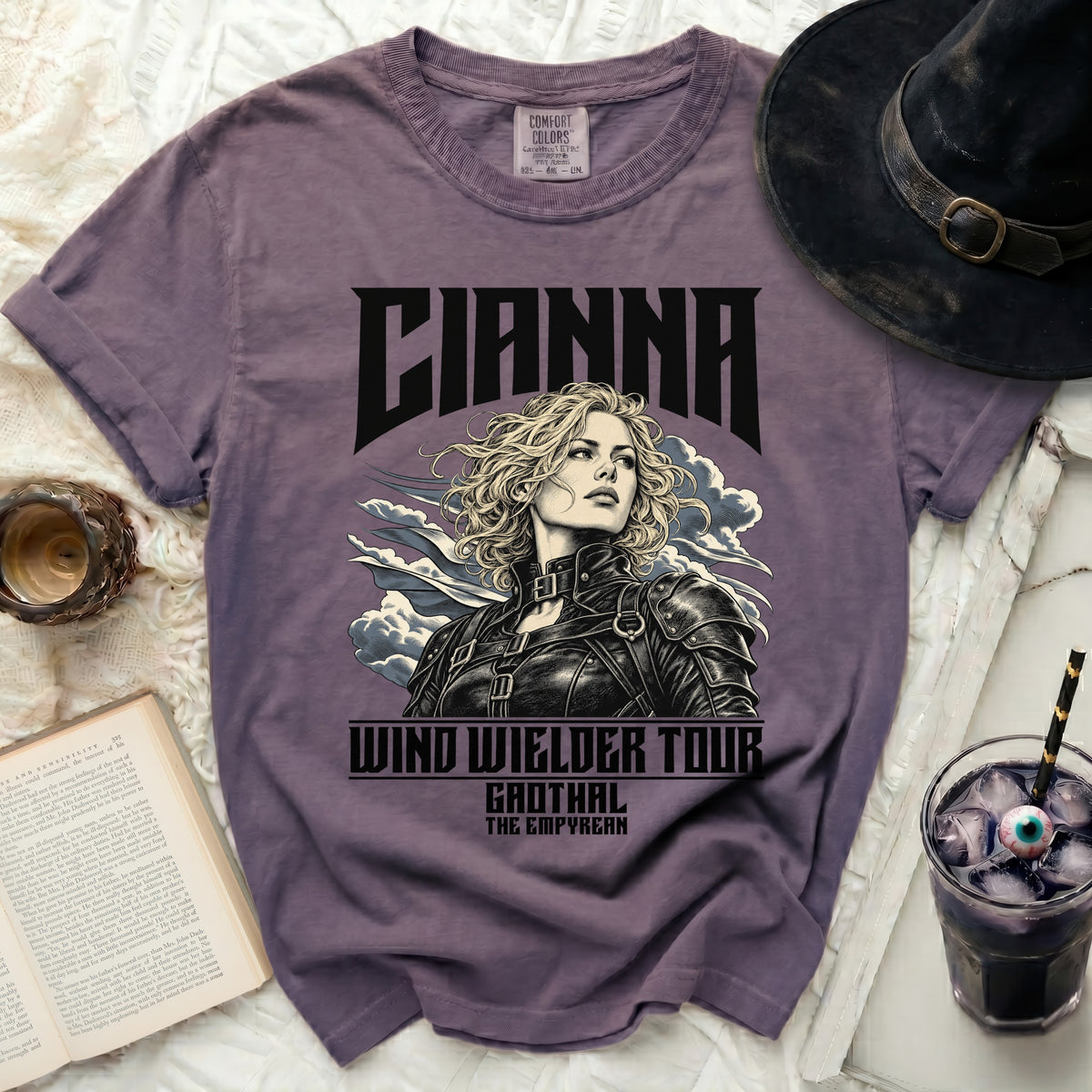Purple t-shirt with graphic of a woman and text "CIANNA WIND WIELDER TOUR GAOTHAL THE EMPYREAN".