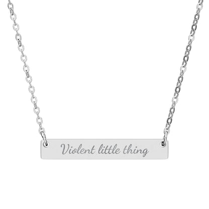 Silver bar necklace engraved with "Violent little thing".