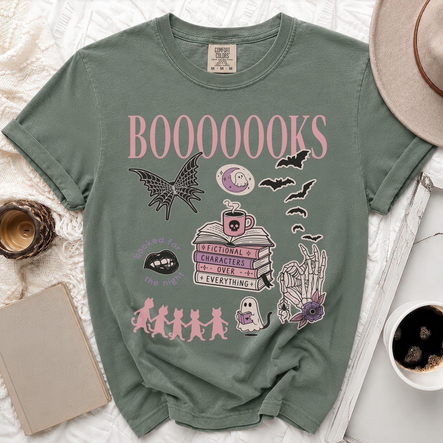 Green t-shirt with "BOOOOOOKS" and book lover graphics.
