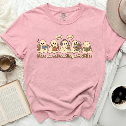 Pink t-shirt with graphic of ghosts reading and "Para normal reading activities" text.