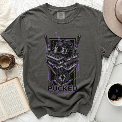 T-shirt with "Pucked Chapters & Chemistry" graphic and hockey gear.