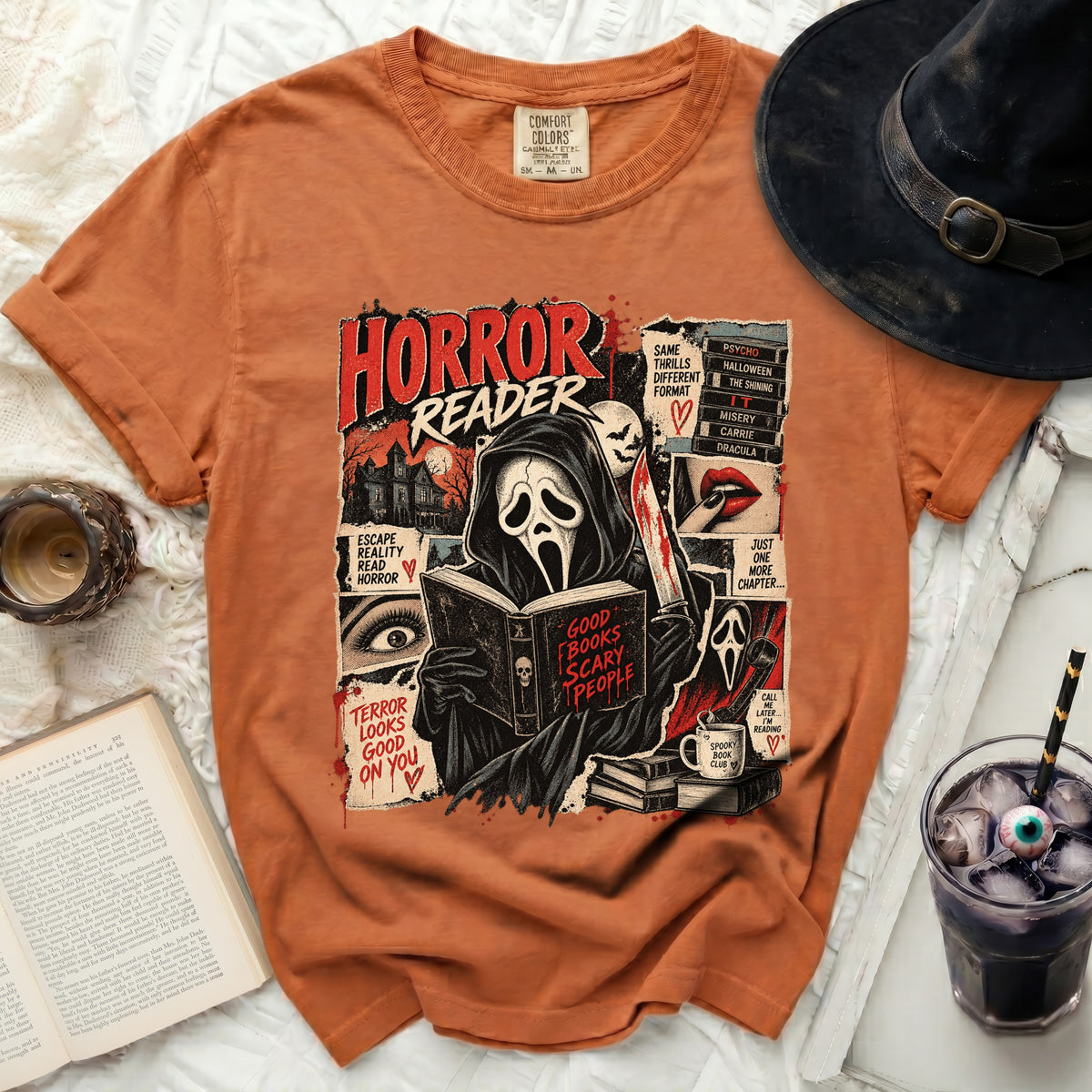 Orange t-shirt with "Horror Reader" graphic featuring ghost reading book.