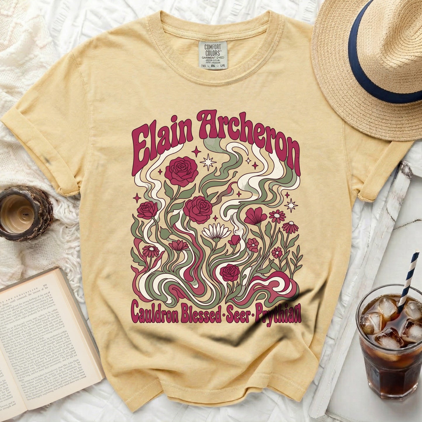 Yellow Comfort Colors t-shirt with "Elain Archeron" and floral design.