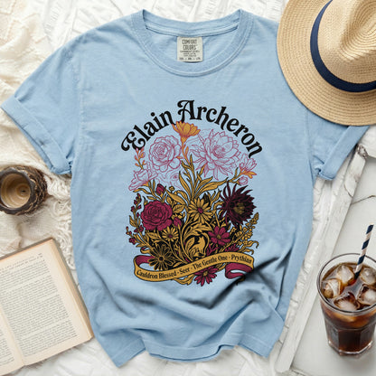Light blue t-shirt with "Elain Acheron" and floral design.
