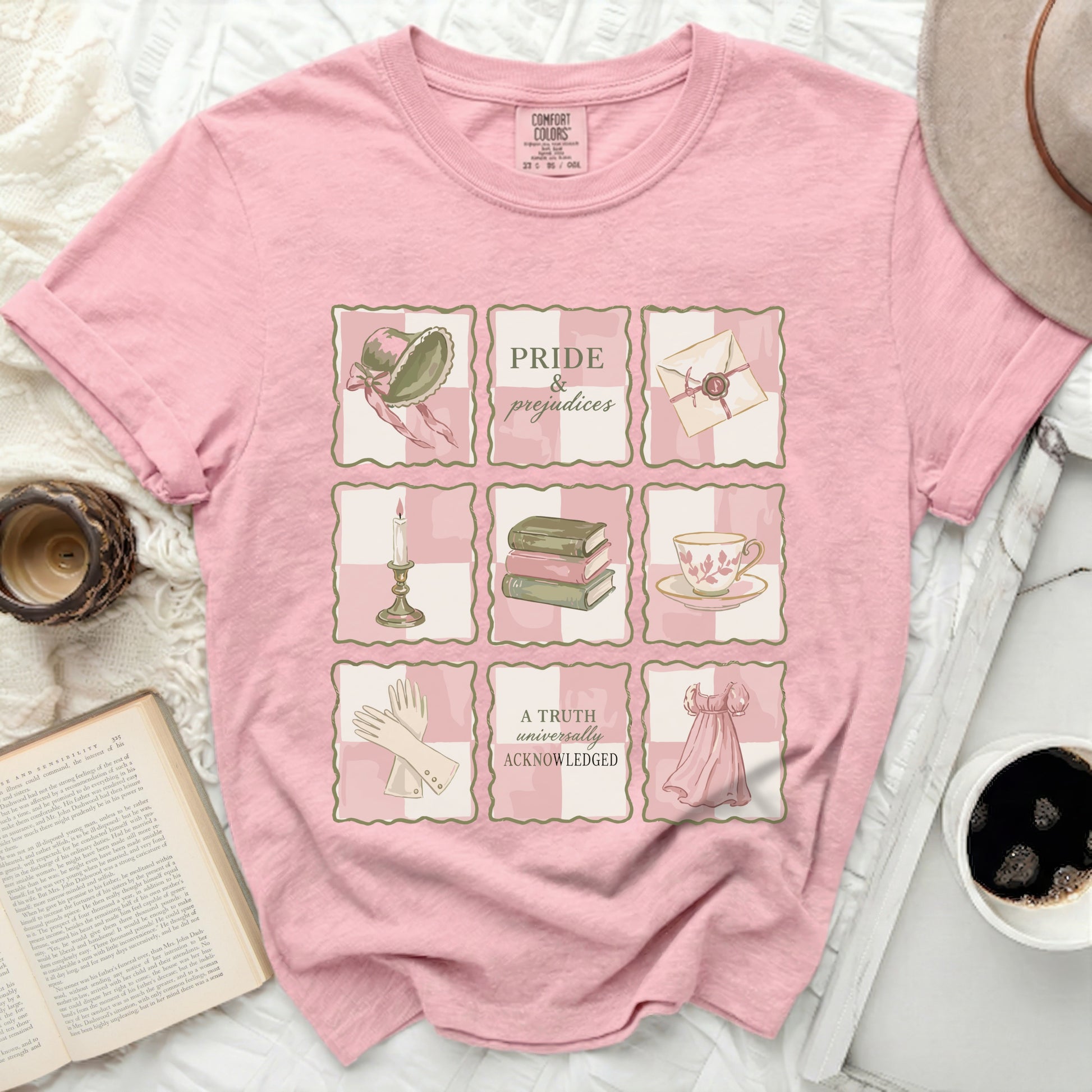 Pink Comfort Colors t-shirt with "Pride & Prejudices" graphic and Victorian motifs.