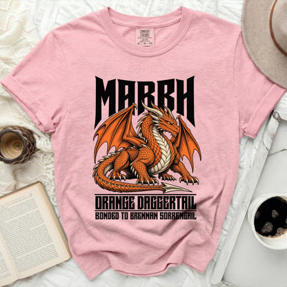 Pink t-shirt with orange dragon graphic and text "MARCH ORANGE DAGGERTAIL BONDED TO BRENNAN SORRENGAIL"