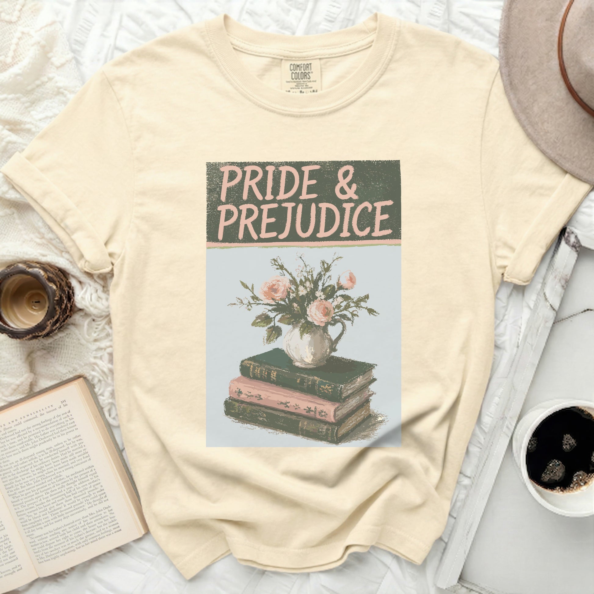 Cream t-shirt with "Pride & Prejudice" title above floral books.