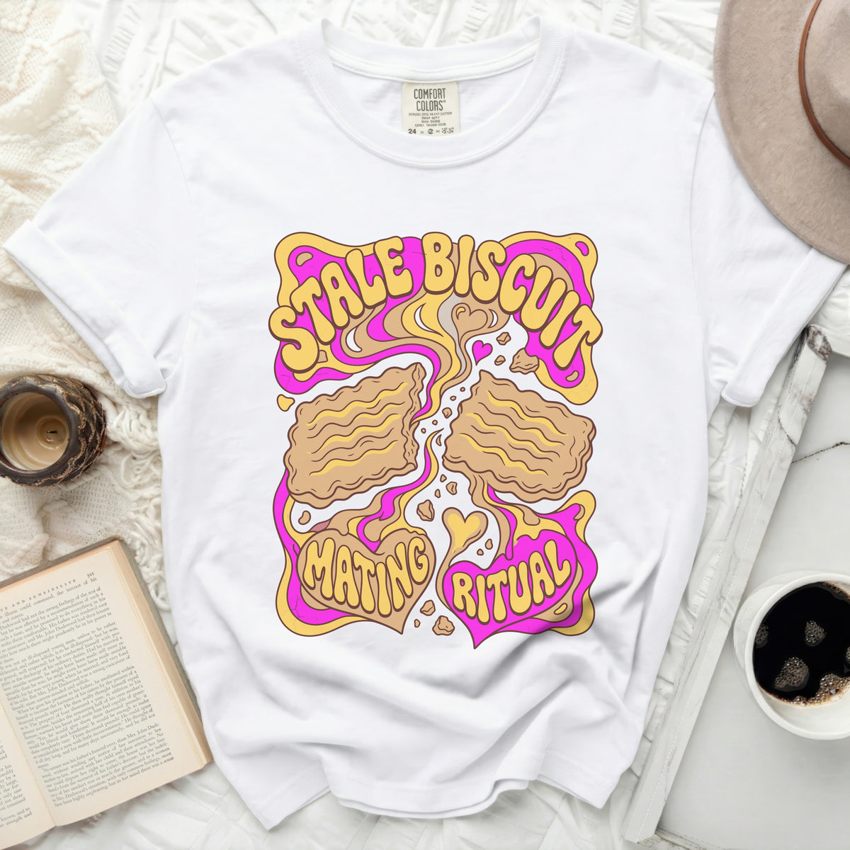 White t-shirt with "Stale Biscuit Mating Ritual" graphic in retro style.