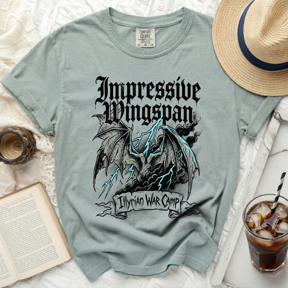 Light blue t-shirt with "Impressive Wingspan Illyrian WAR Camp" dragon graphic.