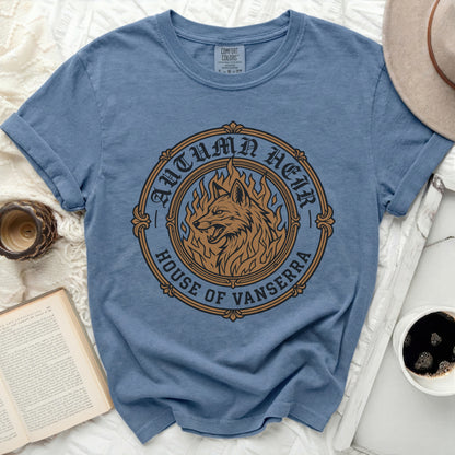Blue t-shirt with a circular graphic of a wolf on fire and text "Autumn Heir House of Vanserra".