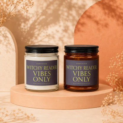 Two candles, one clear and one amber, with labels reading "Witchy Reader Vibes Only".