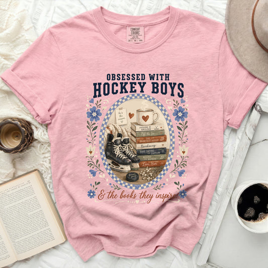 Pink t-shirt with "Obsessed With Hockey Boys & the books they inspire" text and hockey imagery.