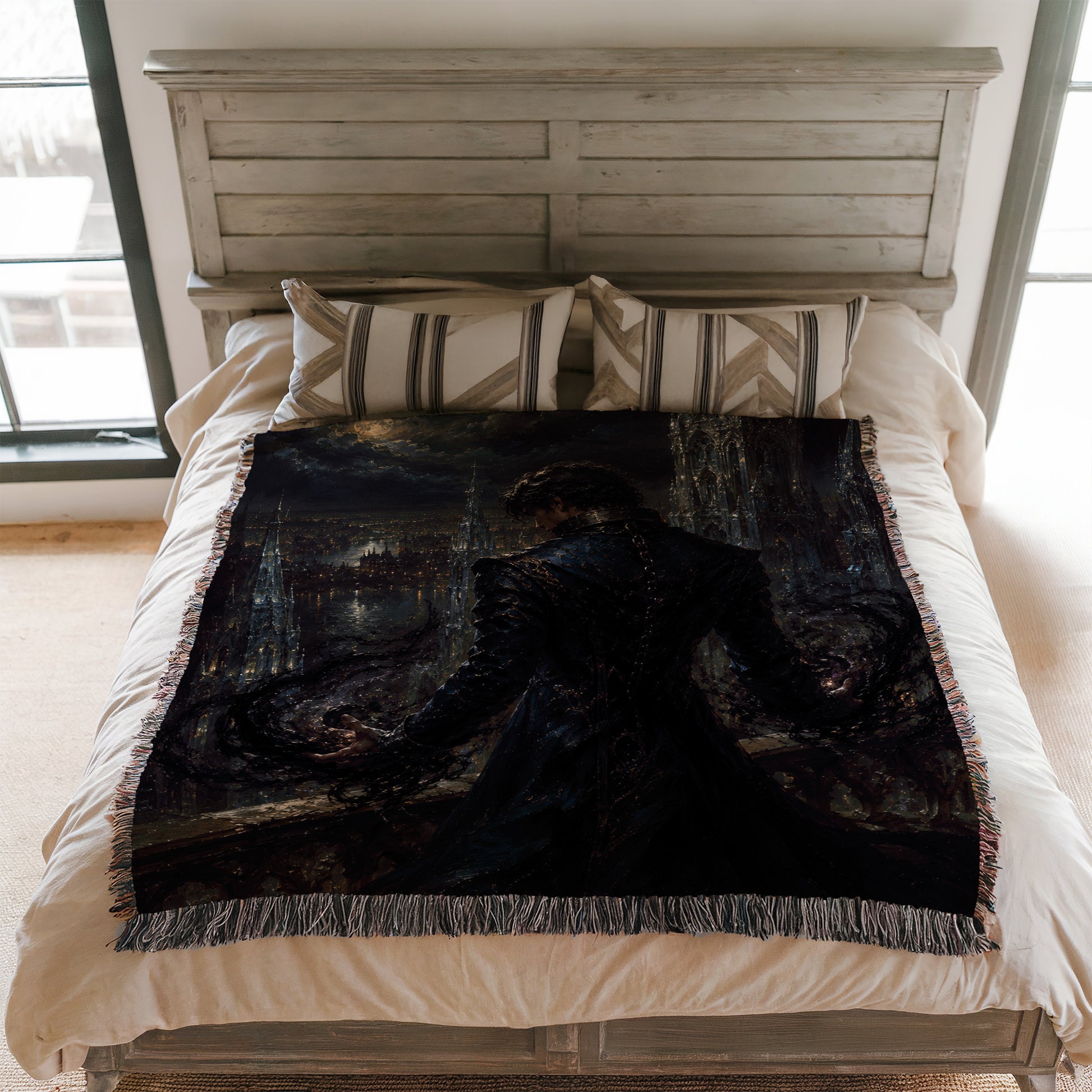 a bedroom with a bed covered in a dark, artistic tapestry depicting a person in a dramatic pose.