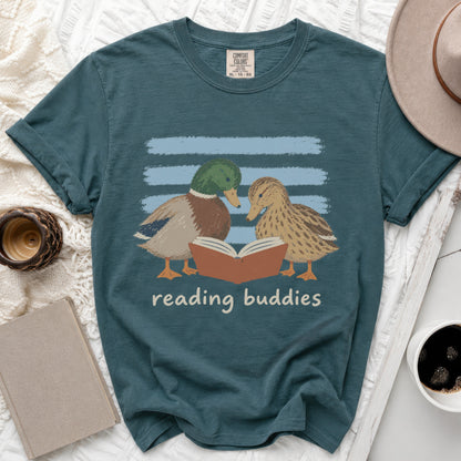 Teal t-shirt with graphic of two ducks reading a book titled "reading buddies".
