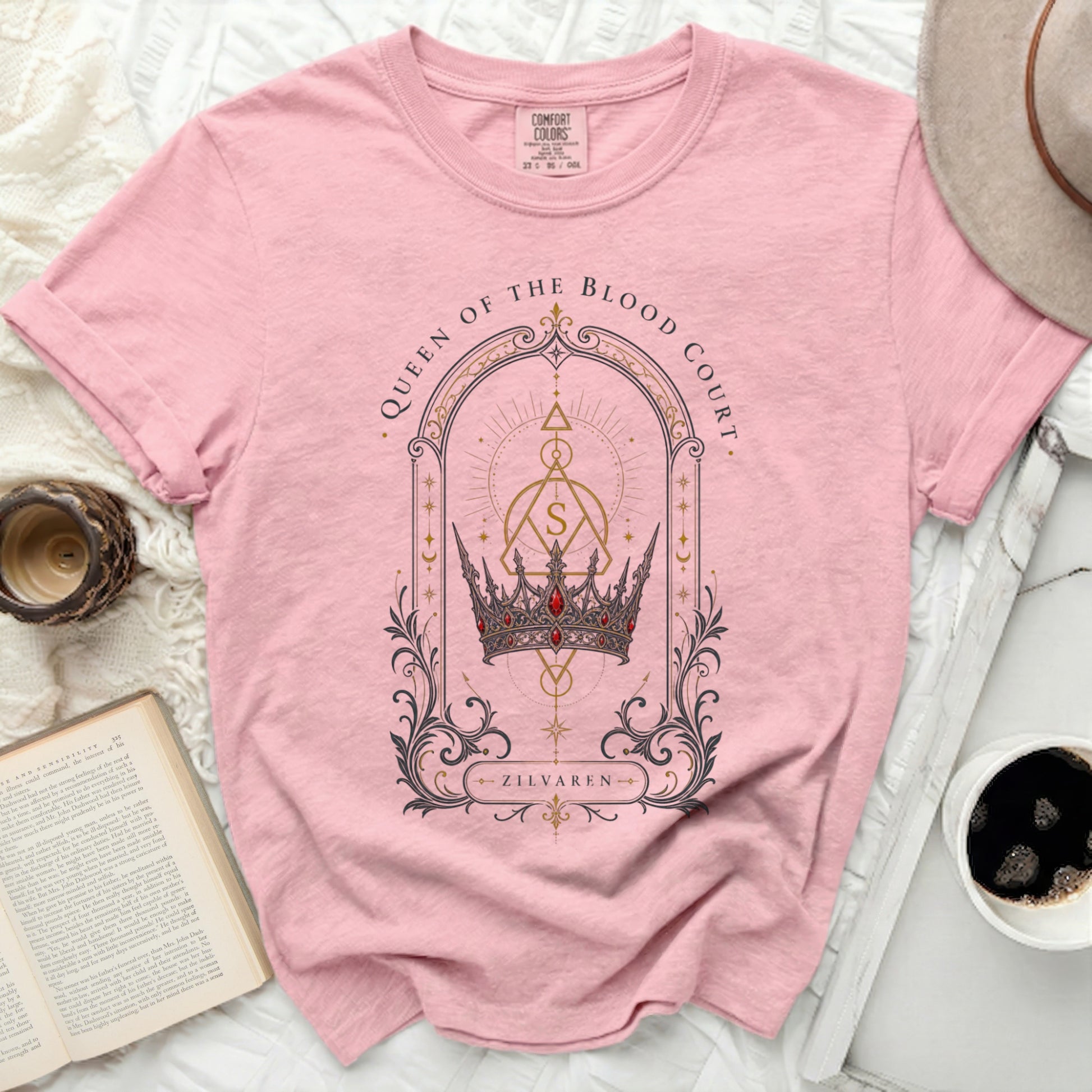 Pink t-shirt with "Queen of the Blood Court Zilvaren" crown graphic.
