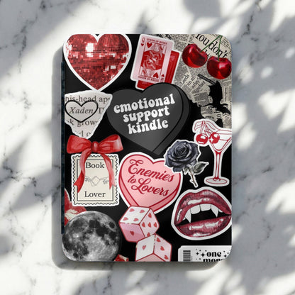 Collage of stickers including text "emotional support kindle" and "Enemies to Lovers."