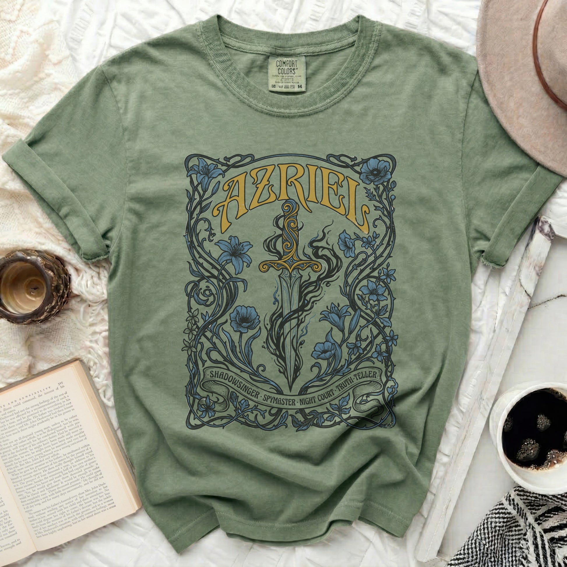 Green t-shirt with Azriel sword and floral design, featuring text.