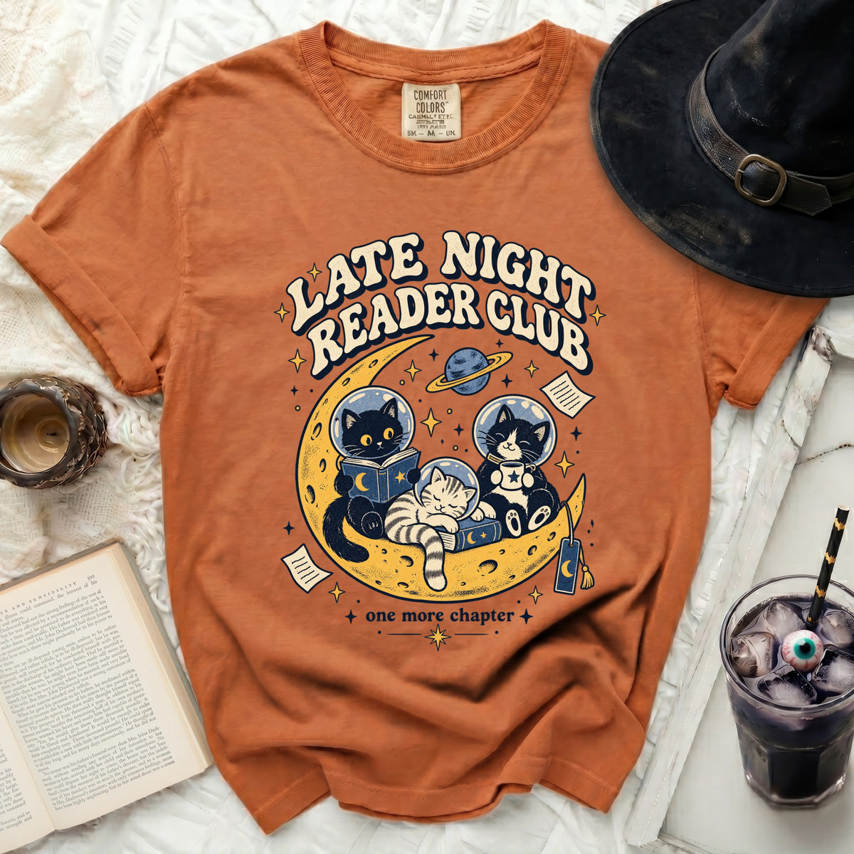 Orange t-shirt with "Late Night Reader Club" and cats on a moon graphic.