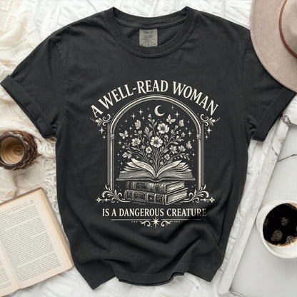 Black t-shirt with "A well-read woman is a dangerous creature" text and floral book graphic.