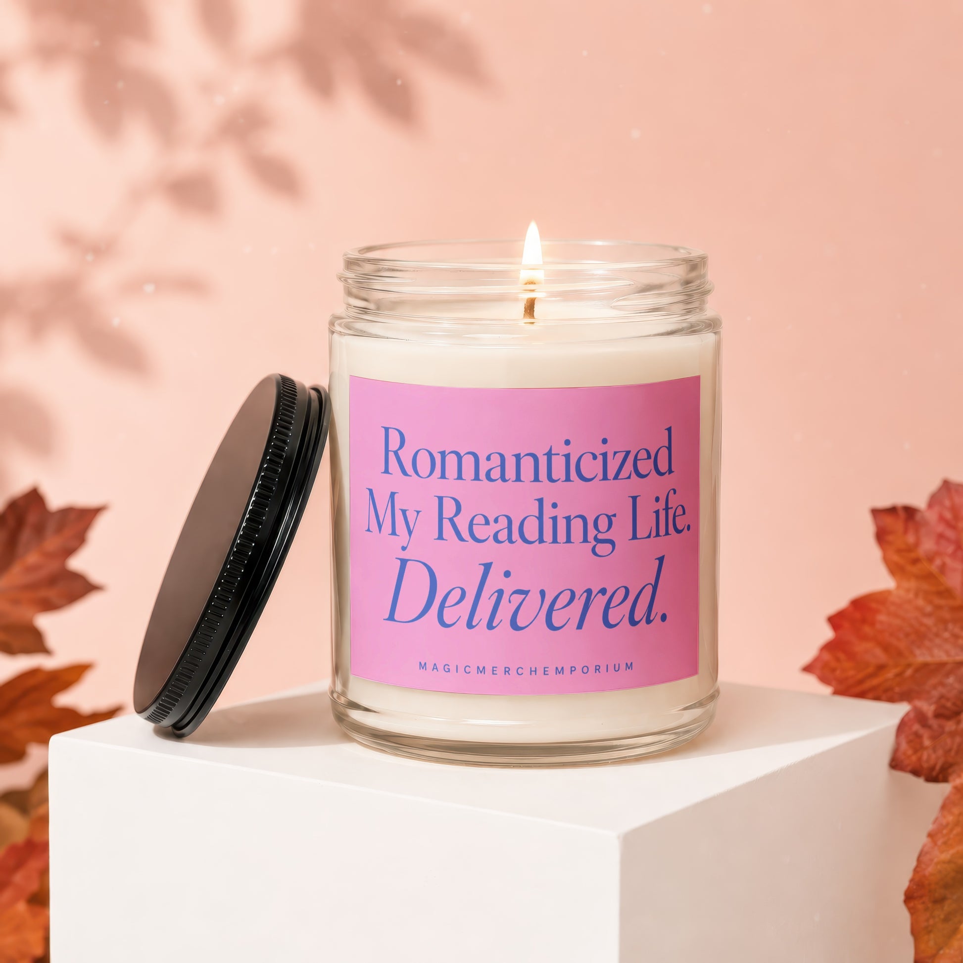 Scented candle with pink label reading, "Romanticized My Reading Life. Delivered."