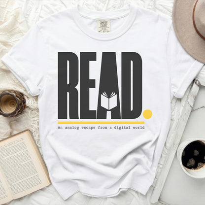 White t-shirt with large "READ" text and subtitle "An analog escape from a digital world."