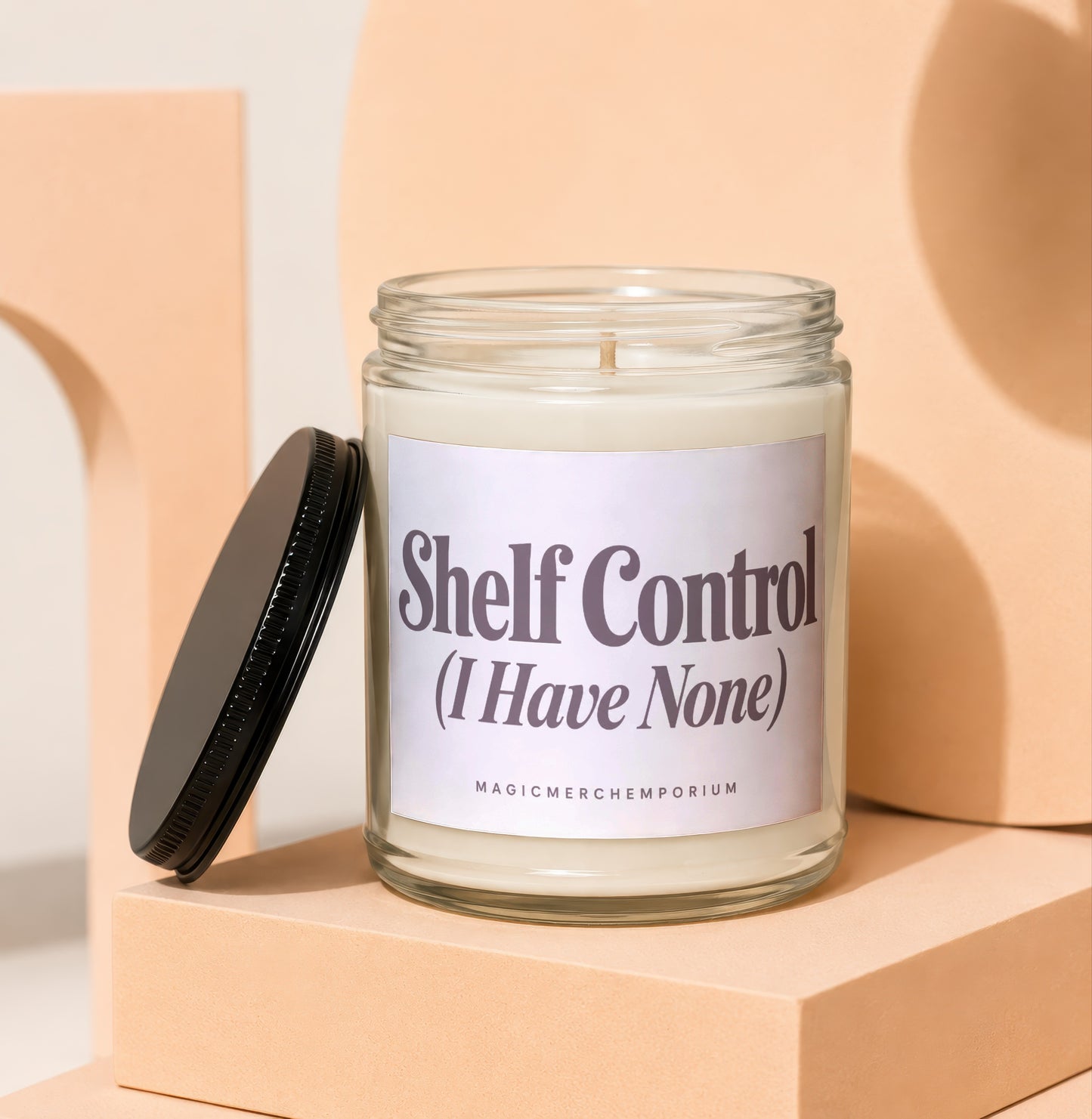 Candle with "Shelf Control (I Have None)" text on the label.