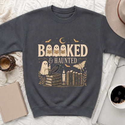 Dark gray sweatshirt with "Booked & Haunted" text and Halloween-themed illustrations.