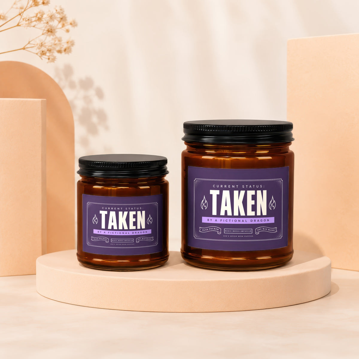 Two amber glass candles with purple labels reading "TAKEN" sit on display stands.