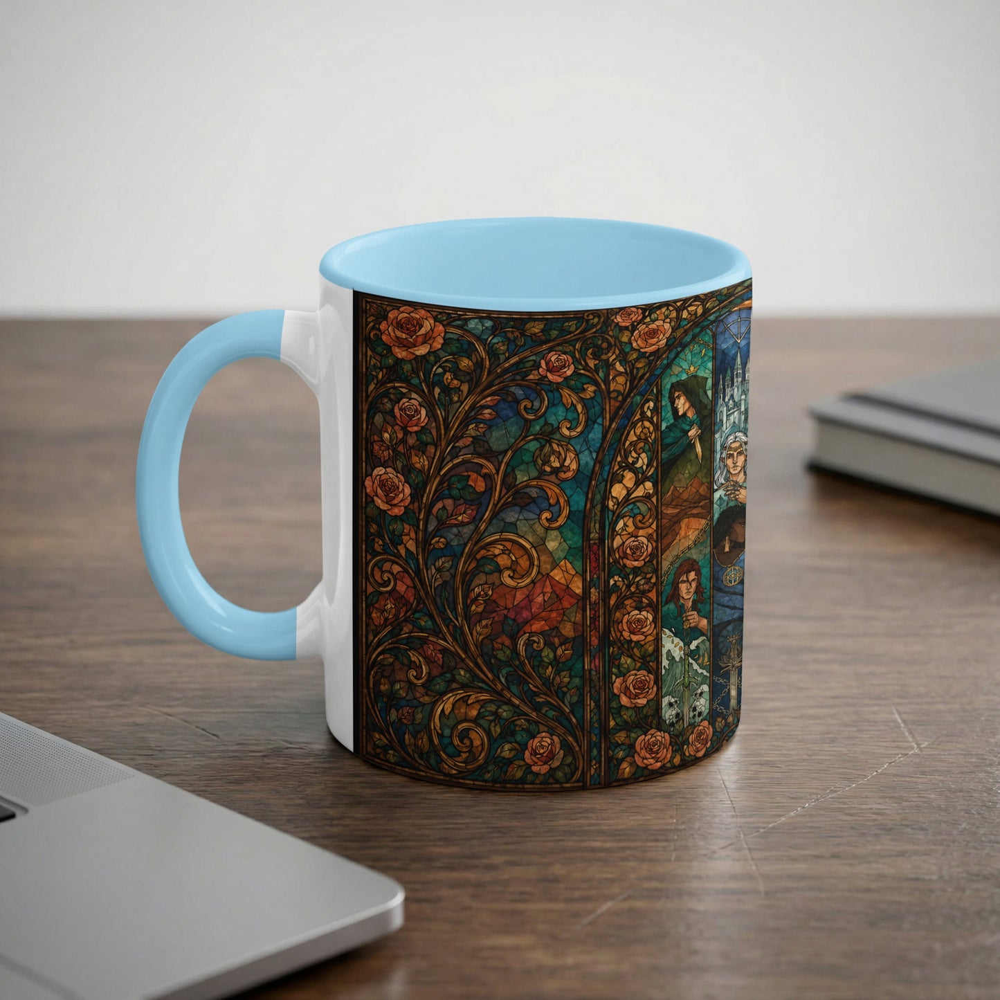 Mug with light blue handle featuring a stained glass design of roses and figures.