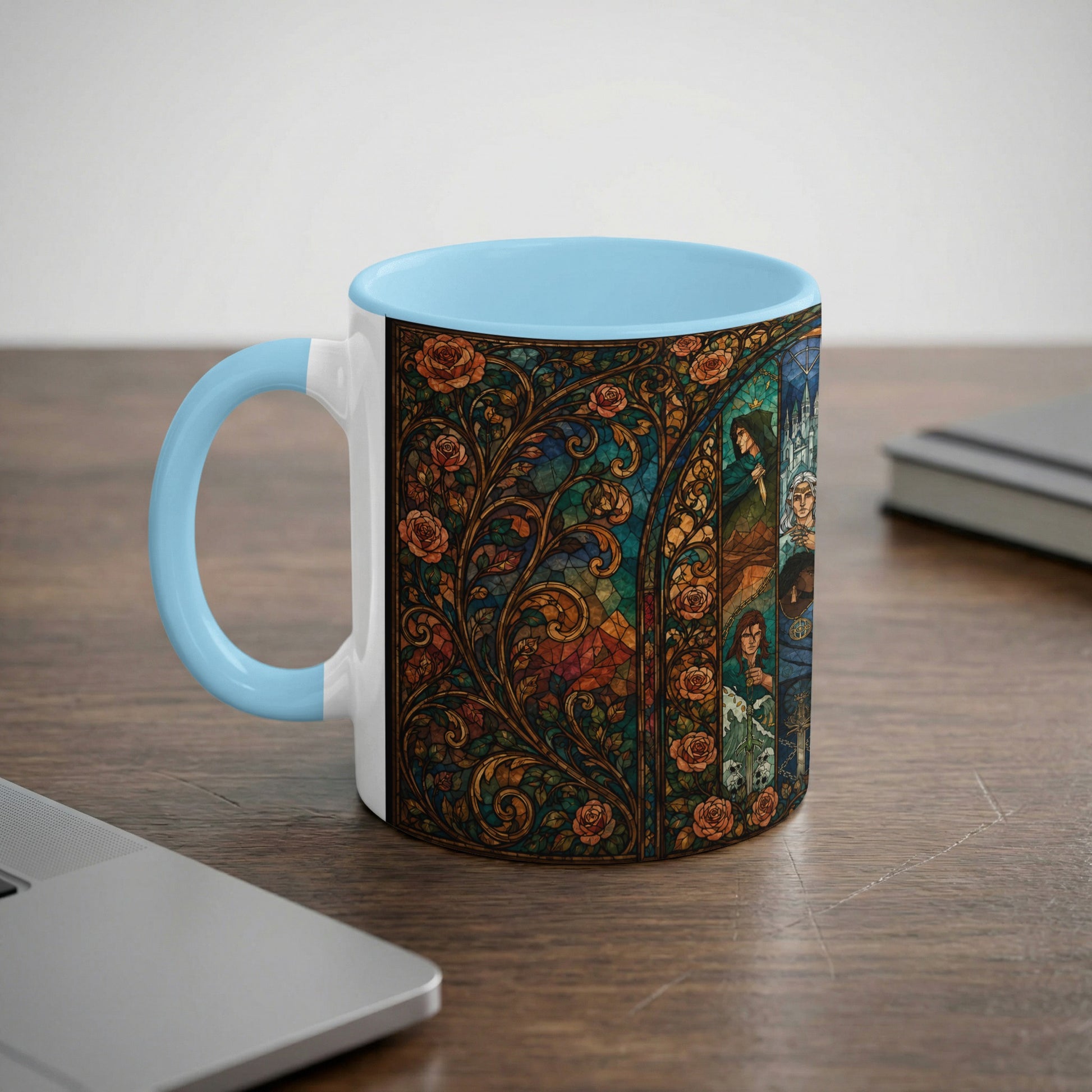 Mug with light blue handle featuring a stained glass design of roses and figures.