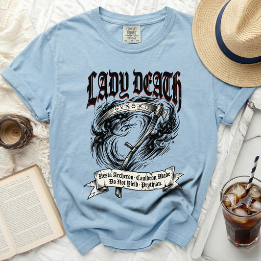 Light blue t-shirt with "Lady Death" and a scythe graphic.