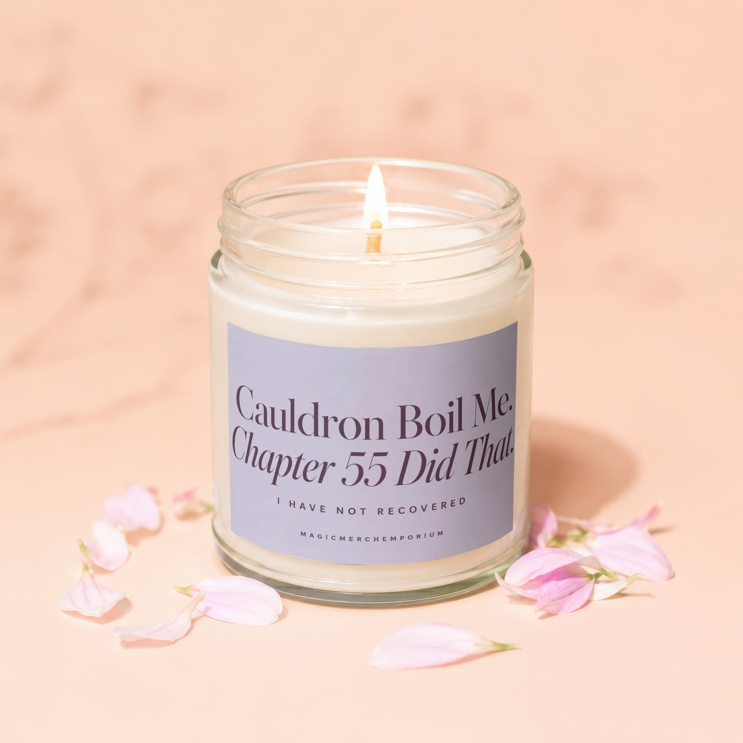 Jar candle with lit flame reads "Cauldron Boil Me. Chapter 55 Did That. I Have Not Recovered."
